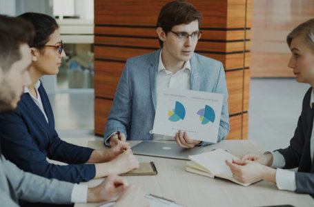 team-discussing-charts-during-a-business-meeting-.jpg Team discussing charts during a business meeting.